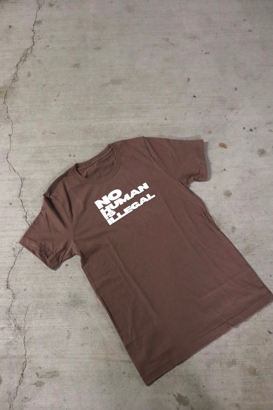 “No Human is Illegal” Tees in Coffee